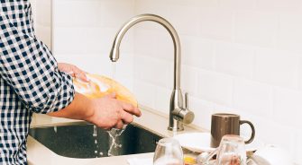 A person washing the dishes