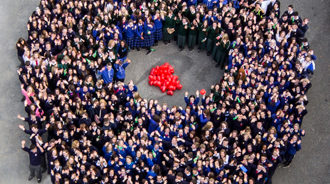 A big group of Students forming a circle