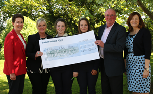 Students receiving a cheque