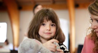 A girl holding her toy