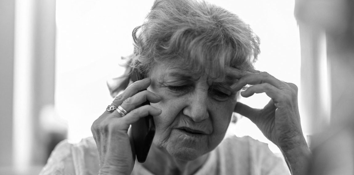 Shot of a tired senior woman using a mobile phone