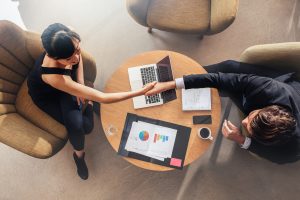 Business colleagues shaking hands on deal